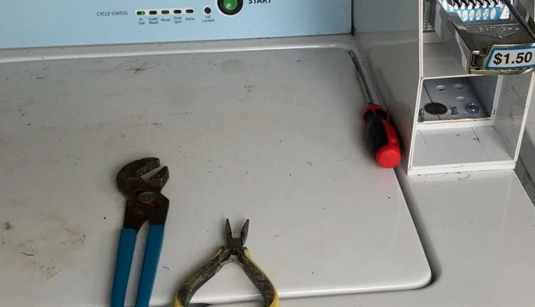 Dryer control panel and tools during a reconditioning check