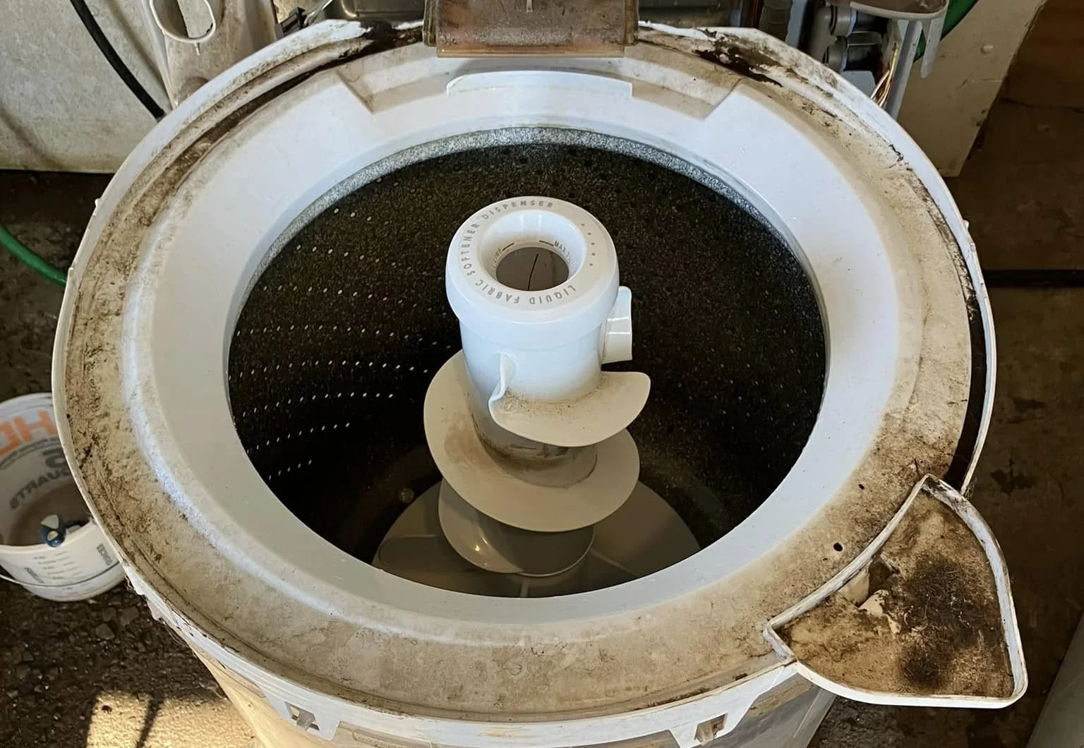 An old washer pulled apart for removal